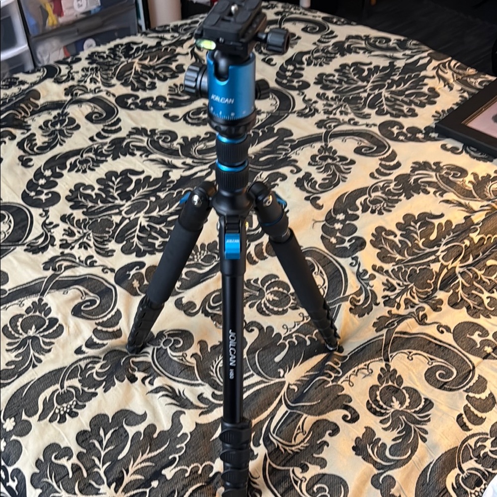Versatile Black and Blue Tripod for Photography